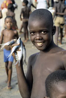 Boy with fishes, Sierra Leone Boy with fishes, Sierra Leone