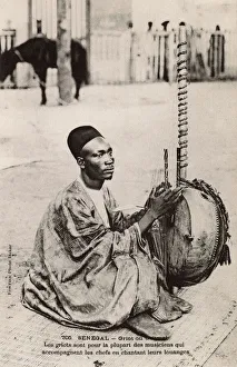 Senegal - Griot playing a Kora Senegal - Griot playing a Kora