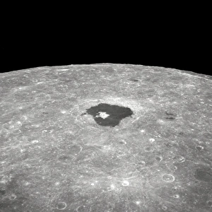 <b class=qtipBold><figcaption>Crater Tsiolkovsky</figcaption></b><br>This is a view of the large crater Tsiolkovsky as photographed by the astronauts during the Apollo 8 lunar orbit mission, looking East toward the lunar horizon. Tsiolkovsky is approximately 150 statute miles in diameter. It was first identified and named by the Russians from photographs taken by their unmanned Luna III spacecraft.<br><em>© NASA</em> Crater Tsiolkovsky