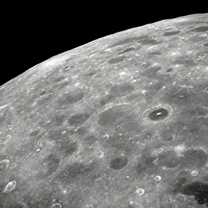 <b class=qtipBold><figcaption>The Lunar Farside</figcaption></b><br>View of the lunar surface taken from the Apollo 8 spacecraft looking southward from high altitude across the Southern Sea. The bright-rayed crater near the horizon is located near 130 degrees east longitude and 70 degrees south latitude. The dark floored crater near the middle of the right side of the photograph is about 70 kilometers (45 statute miles) in diameter. Both features are beyond the eastern limb of the Moon as viewed from earth; neither has a name.<br><em>© NASA</em> The Lunar Farside