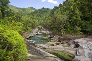 Babinda creek - this river flows picturescquely over hugh boulders down a narrow gorge Babinda creek - this river flows picturescquely over hugh boulders down a narrow gorge