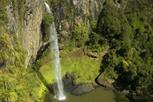 Bridal Veil Falls - water rushes in a thin jet down a steep ledge into a large pool Bridal Veil Falls - water rushes in a thin jet down a steep ledge into a large pool