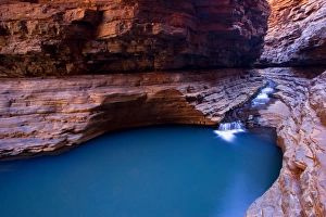 Kermits Pool - a stream is flowing down Hancock Gorge, surrounded by steep Kermits Pool - a stream is flowing down Hancock Gorge, surrounded by steep