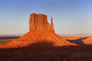 Monument Valley - famous sandstone butte West Mitten. In late evening light Monument Valley - famous sandstone butte West Mitten. In late evening light