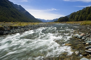 Mountain scenery - Eglinton river flowing down a valley surroundend by mountains Mountain scenery - Eglinton river flowing down a valley surroundend by mountains