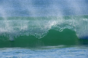 Ocean Wave - turquoise coloured wave breaks at the shore of the eastern beach on Fraser Ocean Wave - turquoise coloured wave breaks at the shore of the eastern beach on Fraser