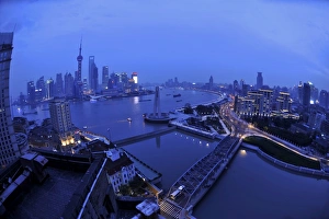 Shanghai China - at dusk Huangpu River and oriental tv tower - Pudong business district Shanghai China - at dusk Huangpu River and oriental tv tower - Pudong business district