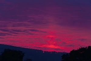 Stormy Sunset - in summer over the river Weser hills and Reinhardswald Stormy Sunset - in summer over the river Weser hills and Reinhardswald