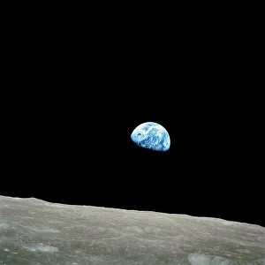 <b class=qtipBold><figcaption>Earthrise over Moon, Apollo 8</figcaption></b><br>Earthrise over Moon, Apollo 8. This famous image, one of the first of the Earth seen from another world, was taken by US astronauts on board the Apollo 8 spacecraft on 24th December 1968 as they orbited the Moon. The astronauts saw this view with the Moon's surface at right, but the image is usually displayed in this orientation to show the Earth rising over the Moon. Along with the first photographs of the Earth from space, this photograph become iconic for its depiction of the beauty and fragility of the Earth.<br><em>© NASA/SCIENCE PHOTO LIBRARY</em> Earthrise over Moon, Apollo 8