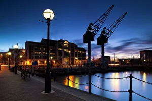 England, Greater Manchester, Salford Quays. Cranes overlooking Ontario Basin part of the England, Greater Manchester, Salford Quays. Cranes overlooking Ontario Basin part of the