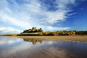 England, Northumberland, Bamburgh Castle. Bamburgh Castle and dunes near Bamburgh village England, Northumberland, Bamburgh Castle. Bamburgh Castle and dunes near Bamburgh village