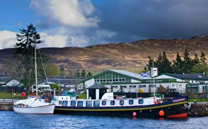 Scotland, Scottish Highlands, Fort Augustus. Tourist sight seeing barge moored on the Scotland, Scottish Highlands, Fort Augustus. Tourist sight seeing barge moored on the