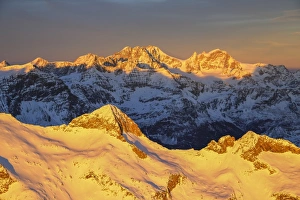 Aerial view of peak Baroni and Bernina Group at sunset, Masino Valley, Valtellina Aerial view of peak Baroni and Bernina Group at sunset, Masino Valley, Valtellina