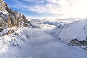 Aerial view of Valle Ombretta covered by clouds from Marmolada, Dolomites, Veneto, Italy Aerial view of Valle Ombretta covered by clouds from Marmolada, Dolomites, Veneto, Italy