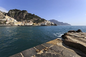 Amalfi harbour quayside and view towards Amalfi town, Costiera Amalfitana (Amalfi Coast) Amalfi harbour quayside and view towards Amalfi town, Costiera Amalfitana (Amalfi Coast)