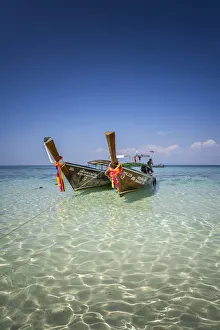 Amazing Blue Water at Bamboo Beach, Maya Bay with long tail boats, Phi Phi Lay Island Amazing Blue Water at Bamboo Beach, Maya Bay with long tail boats, Phi Phi Lay Island