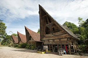Batak Toba village houses with high ended roof and tribal carvings, Tomuk, Samosir Island Batak Toba village houses with high ended roof and tribal carvings, Tomuk, Samosir Island