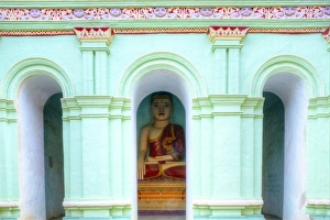 Buddha inside a cave temples on Shwe Ba Hill on the west bank of Chindwin River near Pho Buddha inside a cave temples on Shwe Ba Hill on the west bank of Chindwin River near Pho