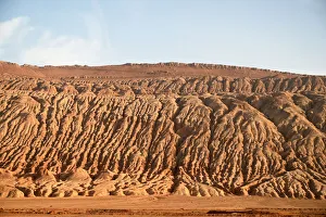 Buildings dwarfed by vast Gobi desert landscape along the Silk Road near Turfan, Xinjiang Buildings dwarfed by vast Gobi desert landscape along the Silk Road near Turfan, Xinjiang