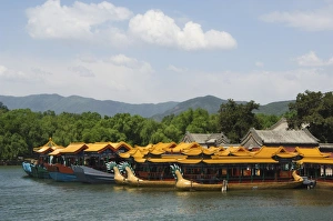 Dragon boats on Kunming Lake at Yihe Yuan (The Summer Palace), UNESCO World Heritage Site Dragon boats on Kunming Lake at Yihe Yuan (The Summer Palace), UNESCO World Heritage Site