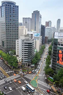 Elevated view of a busy city centre street and high rise buildings on a rainy summer day Elevated view of a busy city centre street and high rise buildings on a rainy summer day