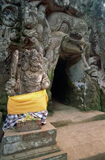Guardian statue and entrance to the Goa Gajah Guardian statue and entrance to the Goa Gajah