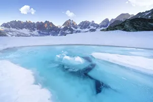 Melting ice on surface of Forbici Lake during spring thaw, Valmalenco, Valtellina Melting ice on surface of Forbici Lake during spring thaw, Valmalenco, Valtellina