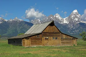 The Moulton Barn on Mormon Row with the Grand Tetons range in background The Moulton Barn on Mormon Row with the Grand Tetons range in background