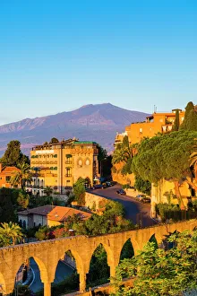 Top of Mount Etna volcano at sunrise rising above Taormina, Sicily, Italy, Mediterranean Top of Mount Etna volcano at sunrise rising above Taormina, Sicily, Italy, Mediterranean