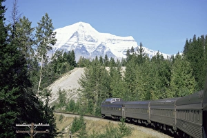 Mount Robson, highest peak in Canadian Rockies, 3964m, seen from Canadian transcontinental express between Jasper and Vancouver, British Columbia, Canada Mount Robson, highest peak in Canadian Rockies, 3964m, seen from Canadian transcontinental express between Jasper and Vancouver, British Columbia, Canada