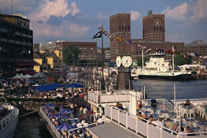 Open air restaurants around harbour, with the clock tower, and the Town Hall behind Open air restaurants around harbour, with the clock tower, and the Town Hall behind