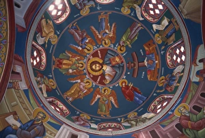 Paintings of Christian figures including Christ, in vibrant colours on the ceiling of the Paintings of Christian figures including Christ, in vibrant colours on the ceiling of the
