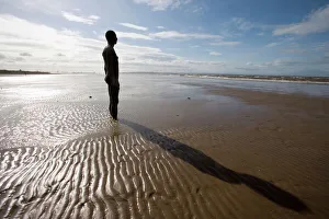 Another Place sculpture by Antony Gormley on the beach at Crosby, Liverpool Another Place sculpture by Antony Gormley on the beach at Crosby, Liverpool