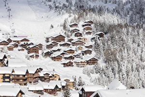 Snowy woods frame the typical alpine village and ski resort, Bettmeralp, district of Raron Snowy woods frame the typical alpine village and ski resort, Bettmeralp, district of Raron