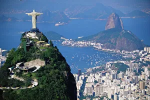 Statue of Christ the Redeemer overlooking city and Sugar Loaf mountain Statue of Christ the Redeemer overlooking city and Sugar Loaf mountain