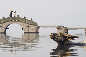 Statue of a golden water buffalo in the waters of West Lake, Hangzhou, Zhejiang Province Statue of a golden water buffalo in the waters of West Lake, Hangzhou, Zhejiang Province