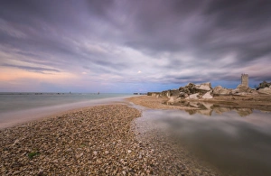 Storm clouds are reflected in the clear water at sunset, Porto Recanati, Province of Macerata Storm clouds are reflected in the clear water at sunset, Porto Recanati, Province of Macerata