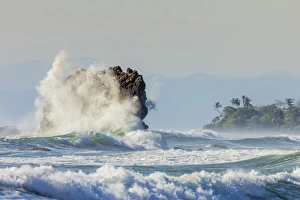 Surf on a sea stack between Santa Teresa and Hermosa beaches, far south Nicoya Peninsula Surf on a sea stack between Santa Teresa and Hermosa beaches, far south Nicoya Peninsula