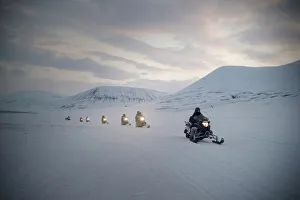 Tourists on snowmobiles (skidoos) near Barentsburg, Svalbard, Arctic, Norway, Scandinavia Tourists on snowmobiles (skidoos) near Barentsburg, Svalbard, Arctic, Norway, Scandinavia