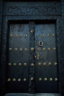 Traditional carved wooden door in Stone Town, Zanzibar, Tanzania, East Africa, Africa Traditional carved wooden door in Stone Town, Zanzibar, Tanzania, East Africa, Africa