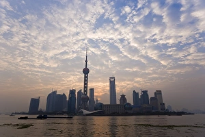 View of Oriental Pearl TV Tower and highrises in the Pudong New Area viewed across the Huangpu River from the Bund, Shanghai View of Oriental Pearl TV Tower and highrises in the Pudong New Area viewed across the Huangpu River from the Bund, Shanghai