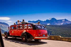 Vintage tour bus on the Sun Road, Glacier National Park, Montana, United States of America Vintage tour bus on the Sun Road, Glacier National Park, Montana, United States of America