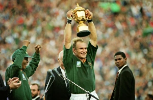 Francois Pienaar lifts the World Cup for South Africa as Nelson Mandela cheers Francois Pienaar lifts the World Cup for South Africa as Nelson Mandela cheers