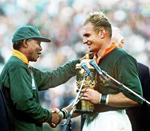 South Africa captain Francois Pienaar receives the World Cup from Nelson Mandela in 1995 South Africa captain Francois Pienaar receives the World Cup from Nelson Mandela in 1995