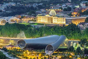 Concert Hall & Exhibition Center in Rike Park and Presidential Palace at night Concert Hall & Exhibition Center in Rike Park and Presidential Palace at night
