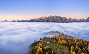 Fog covers the Valmalenco(Val Malenco) with the mountain range of Disgrazia illuminated Fog covers the Valmalenco(Val Malenco) with the mountain range of Disgrazia illuminated