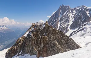 Les Grand Mulets alpine refuge over a rock in Mount Blanc north side over glacier Les Grand Mulets alpine refuge over a rock in Mount Blanc north side over glacier