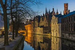 Picturesque blue hour view over Dijver canal with Belfort tower in the background Picturesque blue hour view over Dijver canal with Belfort tower in the background