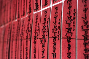 Prayer slips decorate a wall in the Chuk Lam Sim Prayer slips decorate a wall in the Chuk Lam Sim