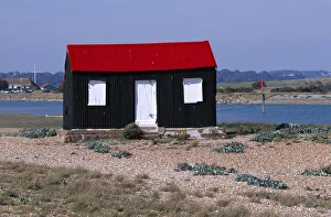 ENGLAND East sussex Rye Rye harbour Red and black corrugated hut with white doors built ENGLAND East sussex Rye Rye harbour Red and black corrugated hut with white doors built